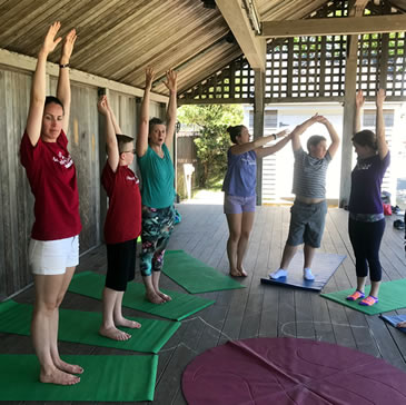 Yoga stretching with campers at Adam's Camp New England